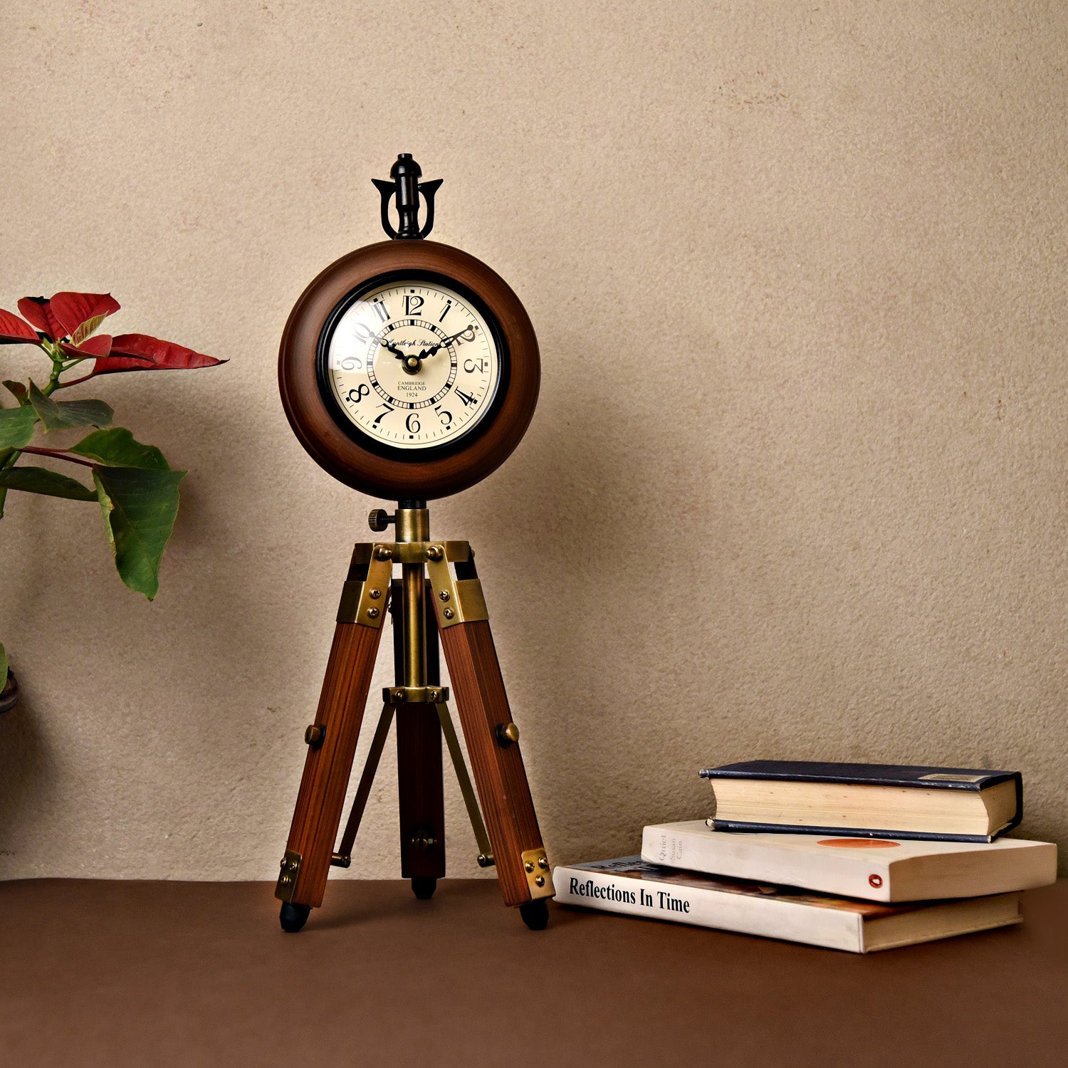 Wooden table clock on a tripod stand